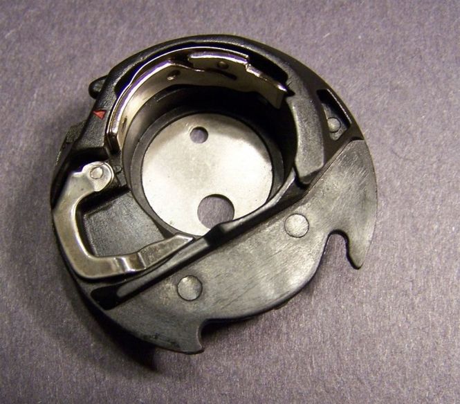 Hovedbilde (G2) Spolehus Bobbin holder MC350E/MC12000/Elna 8300